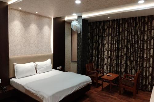Кровать или кровати в номере Hotel Park Regency
