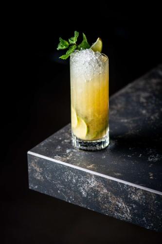 a drink with ice and a lime on a counter at Park Plaza Nottingham in Nottingham