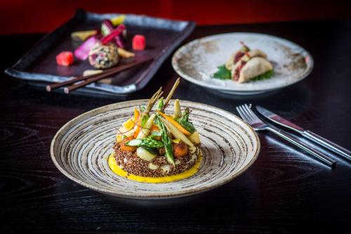 a table with two plates of food on a table at Park Plaza Nottingham in Nottingham