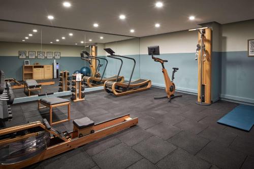 a gym with several exercise equipment in a room at Park Plaza Vondelpark Amsterdam in Amsterdam