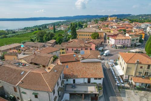 an aerial view of a small town with roofs at Appartamento in Piazza in Moniga