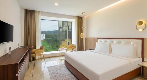 Fezinn Hotel - Best Wayanad Hotel in 2024にあるベッド