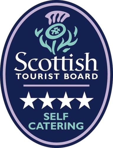 a sign for a scottish tourism board with stars at Harbour Side, Luxury, Twin Level Loft in Burghead