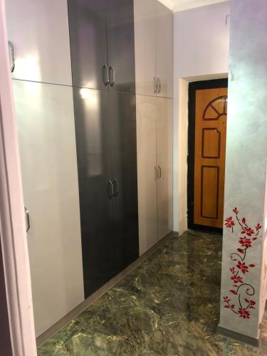 a room with white cabinets and a door at Ashtarak-2 LUX Apartment in Ashtarak