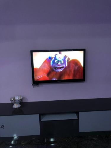 a flat screen tv hanging on a wall at Ashtarak-2 LUX Apartment in Ashtarak