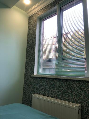 a bedroom with a bed and a window at Ashtarak-2 LUX Apartment in Ashtarak