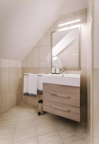 Ванная комната в Apartmanház Soho