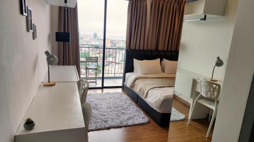 a bedroom with a bed and a view of a city at SkyPool 2BR 9pax Premium Suite@Beacon @Georgetown @Penang in George Town