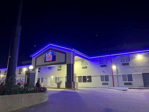 a gas station with a lit up number six at Motel 6 Tulsa, OK Airport in Tulsa