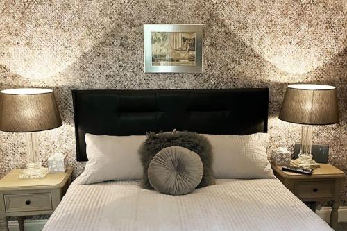 a bedroom with a bed with a stuffed animal on it at Countryside Apartment nr. Dore Train station in Sheffield