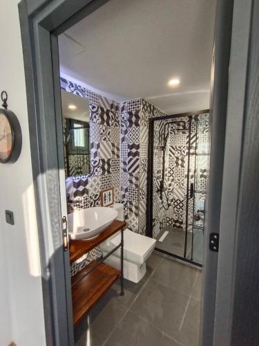 a bathroom with a tub and a sink and a shower at Karaköy in Karaköy Hotel in Istanbul
