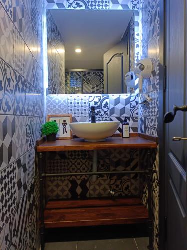 a bathroom with a sink and a mirror at Karaköy in Karaköy Hotel in Istanbul
