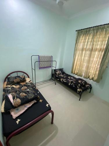 Ένα ή περισσότερα κρεβάτια σε δωμάτιο στο Dzanz Homestay