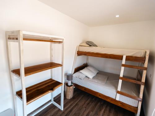 a room with two bunk beds and a ladder at Panama Kite Center in Punta Chame