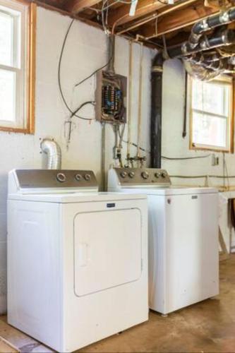 a kitchen with two washing machines and a sink at Bohemian Retreat Newly Remodeled with New Hot tub in Newton