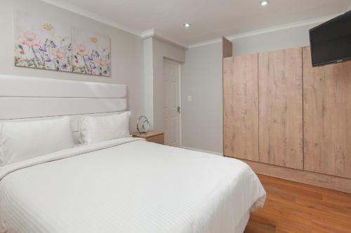 Postel nebo postele na pokoji v ubytování Absolute Ocean Boutique Guesthouse