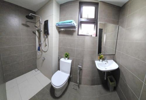 a bathroom with a toilet and a sink at Sky Garden Homestay, Presint 15 Putrajaya in Putrajaya