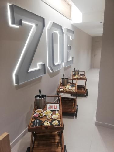 a restaurant with two tables with plates of food at ZOE LUXURY SUITES in Catania