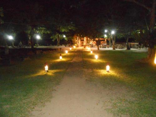 a park at night with lights in the grass at Lake Resort Bolgoda in Wadduwa