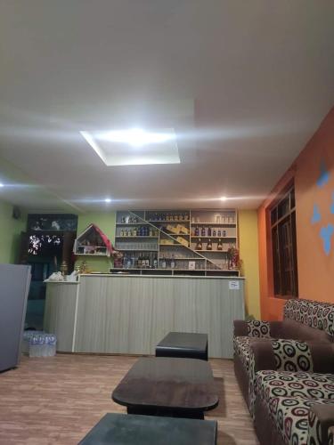 a lobby with couches and a bar in a restaurant at Hotel Swornim Namobuddha in Dhulikhel