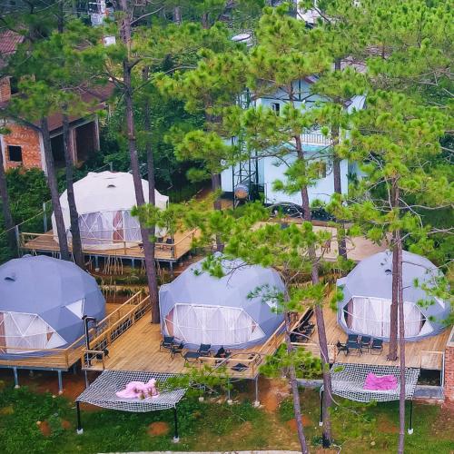 an aerial view of a group of tents on a deck at De Vivre Homestay Măng Đen in Kon Von Kla