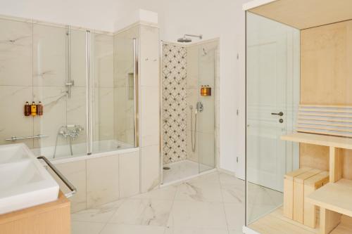 a bathroom with a shower and a sink at Palace Natali in Dubrovnik