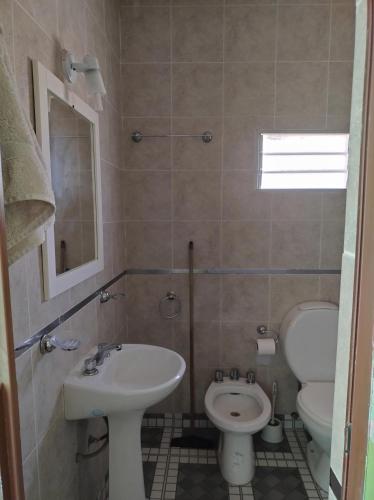 a bathroom with a sink and a toilet at yusulpayki in Termas de Río Hondo