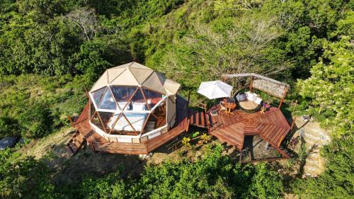 an overhead view of a house with a roof at Glamping - Habla con la Luna in Santa Marta