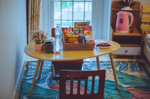 a table with food on it in a room at De Vivre Homestay Măng Đen in Kon Von Kla