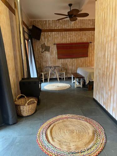 a room with two large rugs on the floor at Cabañas Miraelqui in Pisco Elqui
