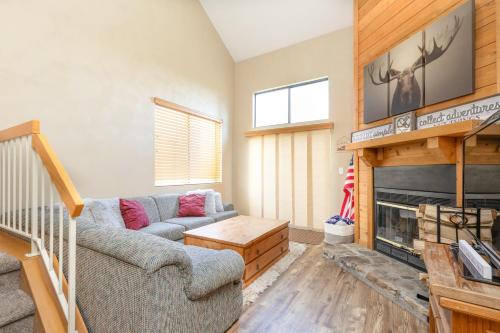 a living room with a couch and a fireplace at Seven Springs 2BRLoft Premium Condo, sleeps 11! condo in Champion