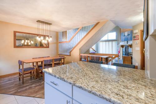 a kitchen and dining room with a table and chairs at Seven Springs 2BRLoft Premium Condo, sleeps 11! condo in Champion