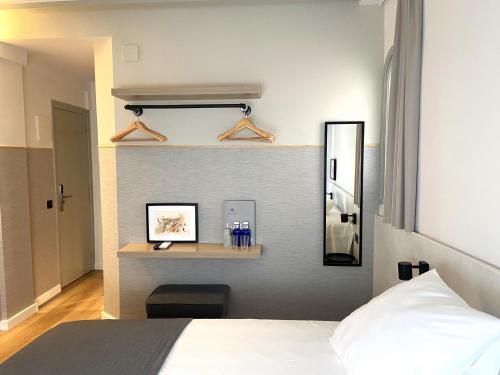 Postel nebo postele na pokoji v ubytování Calendula Hotel & Apartaments