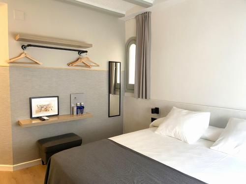 Postel nebo postele na pokoji v ubytování Calendula Hotel & Apartaments