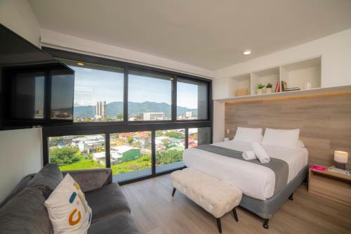Postel nebo postele na pokoji v ubytování BEE Suites San José - Escalante