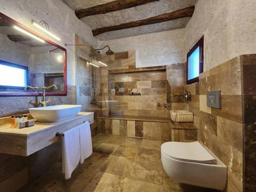 a bathroom with a sink and a toilet at Key of Cappadocia - House of Eos in Avanos