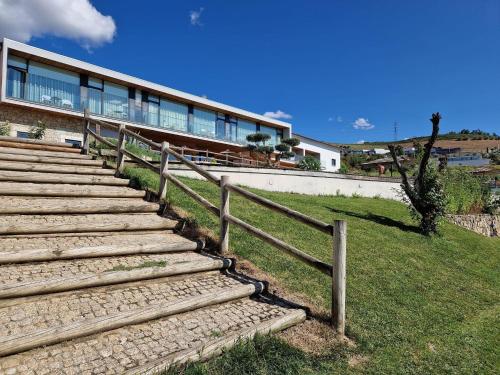 a set of stairs in front of a building at Douro Cister Hotel Resort in Ucanha