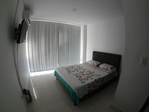 Katil atau katil-katil dalam bilik di Balcones de la Rivera Apartamento Azulejo 3