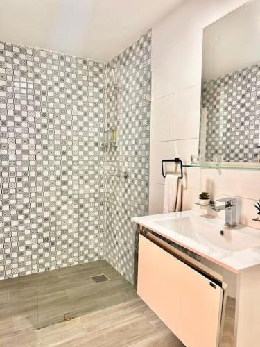 a bathroom with a sink and a shower at New Loft Apt Full AC King Bed in Santo Domingo