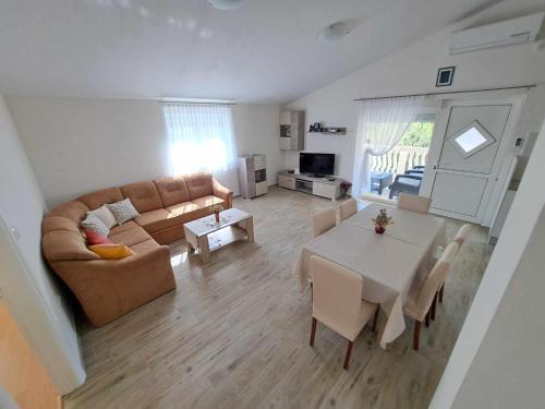 a living room with a couch and a table at Apertment Kiki in Starigrad-Paklenica