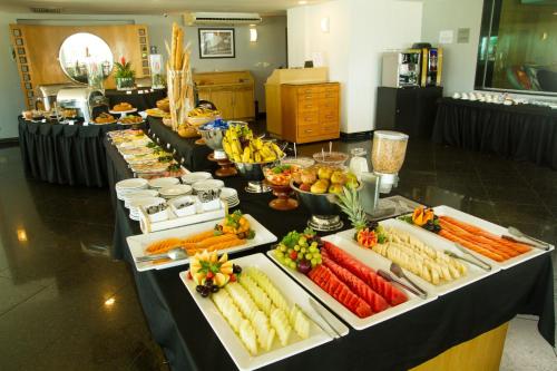 a buffet line with many different types of fruits and vegetables at Atlantico Sul Hotel in Rio de Janeiro