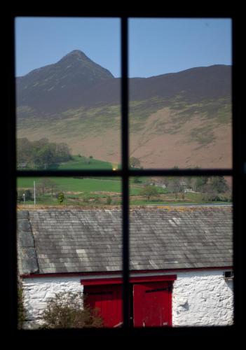 a view of a mountain from a window at Littletown Farm Guest House in Keswick