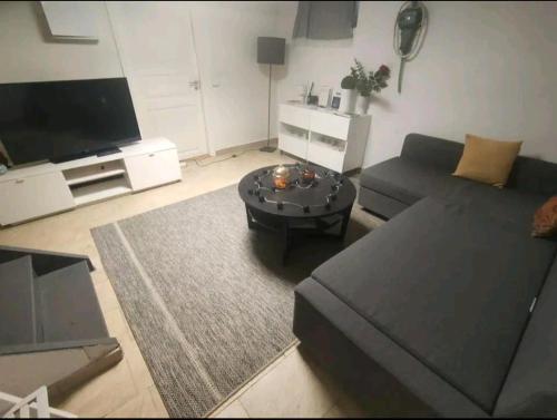 a living room with a couch and a coffee table at Remarkable 1-Bed Apartment in Orebro in Örebro