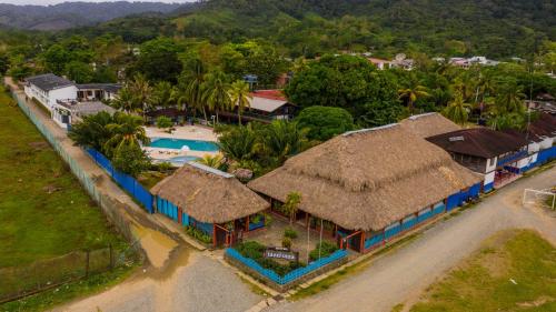 an aerial view of a resort with a swimming pool at Tacarcuna Lodge in Capurganá