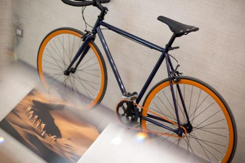 a bike with an orange wheel is on display at theBed in Pescara