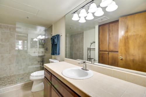 a bathroom with a sink and a toilet and a mirror at Incline Village Condo with Balcony 1 Mi to Trail! in Incline Village