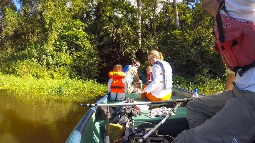 a group of people on a boat in the water at Tortuguero Adventures Beach House in Tortuguero