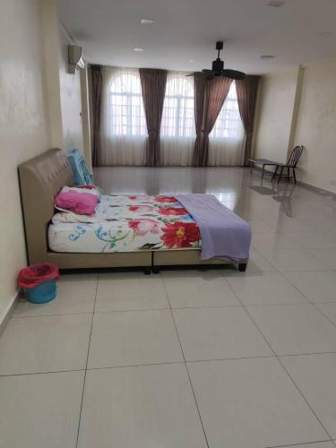 a bedroom with a bed sitting on a tiled floor at ZMK STAY 