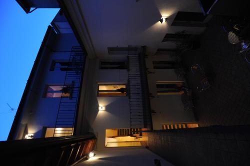 a staircase in a building at night with lights at Albergo Orologio in Brescia