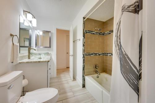 a bathroom with a toilet and a tub and a sink at Florida Vacation Rental Near Historic Downtown in Saint Augustine